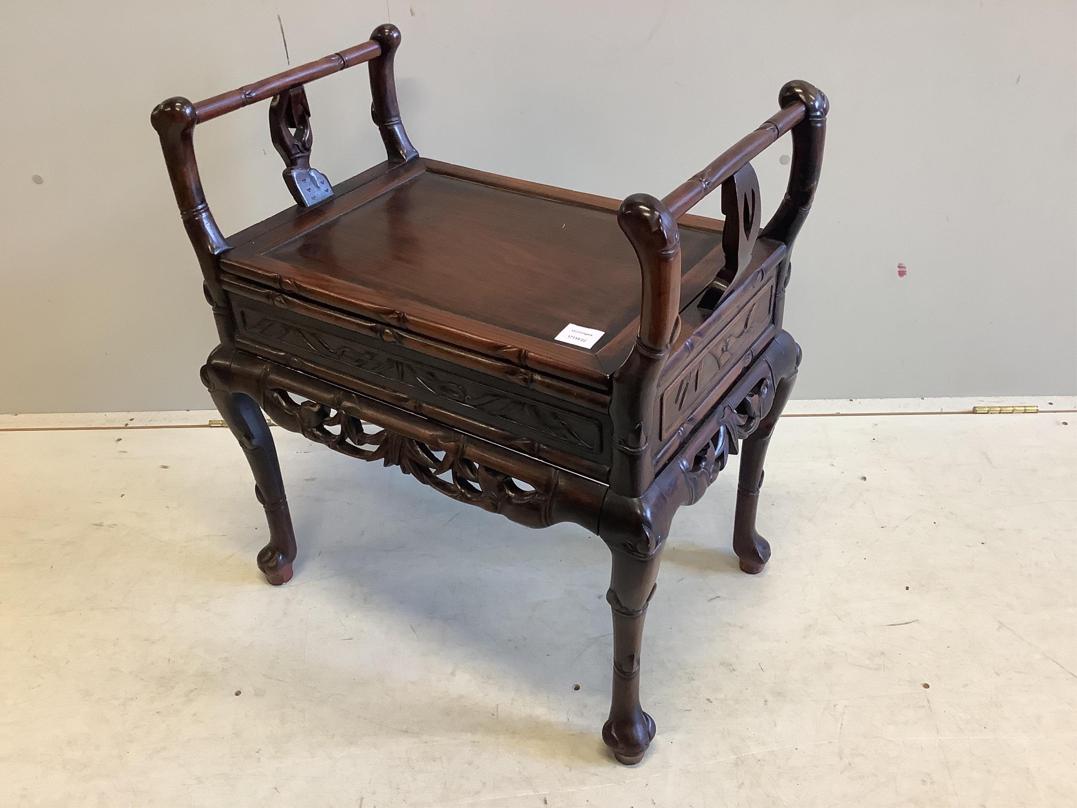 A Chinese hardwood piano stool, width 64cm, depth 43cm, height 70cm. Condition - good